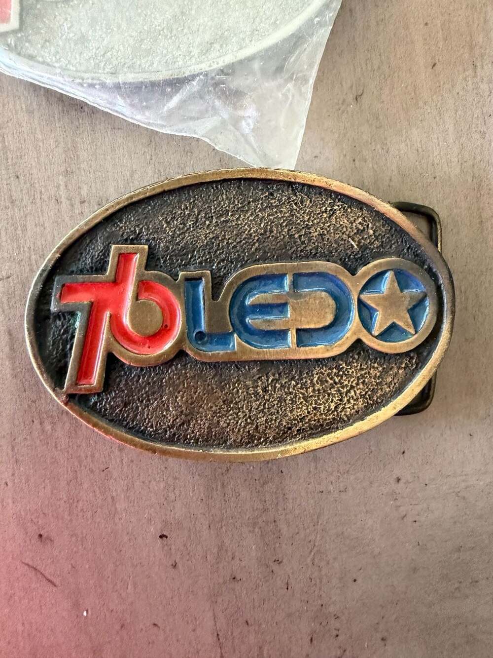 Vintage 1988 Toledo Rodeo Brass Belt Buckle with Red and Blue Enamel